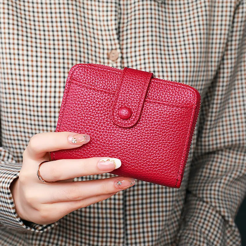 Women's lychee pattern PU leather short wallet showing card slots and cash compartment