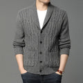 Man wearing a dark grey jacquard knit cardigan jacket with a straight cut and open front.