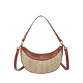 Hard straw women's crossbody dumpling bag in black with contrast stitching and interior compartments