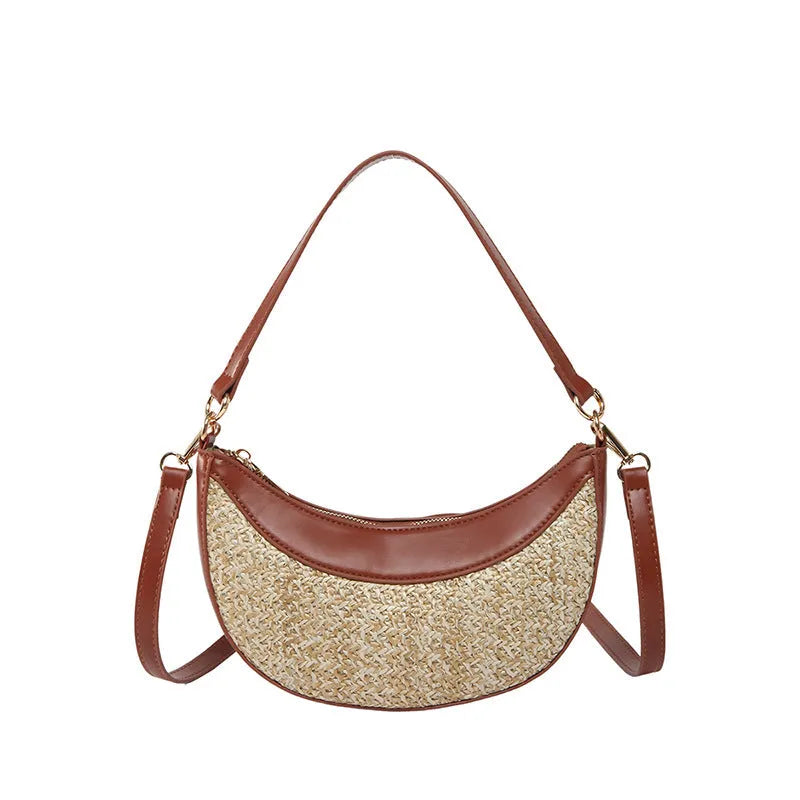 Hard straw women's crossbody dumpling bag in black with contrast stitching and interior compartments