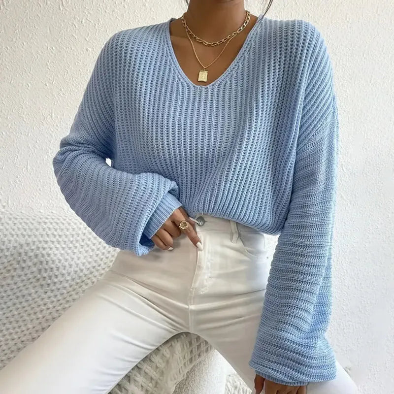 Women's solid colour long sleeve polyester pullover jumper in a loose casual fit.