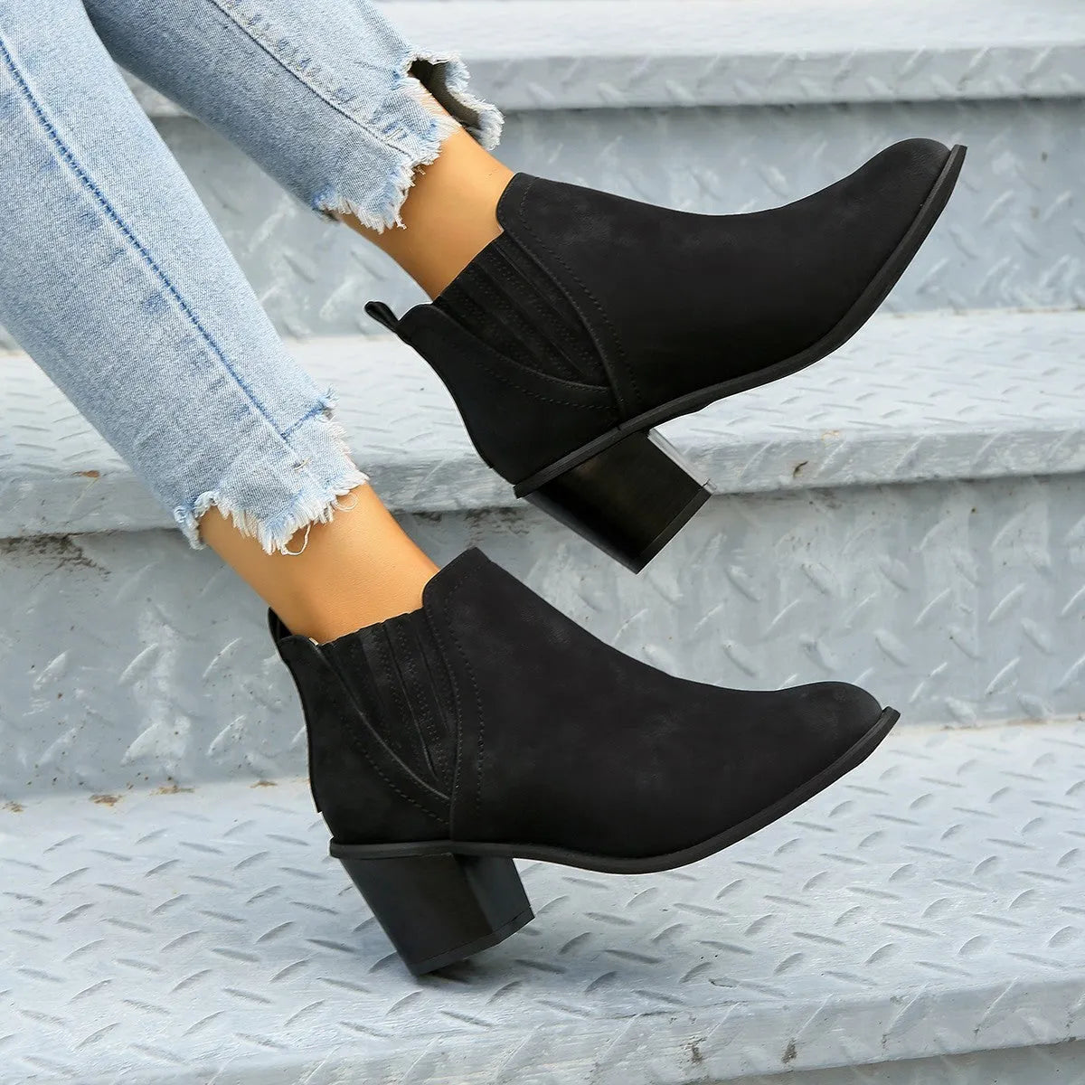 Women's black pointed toe ankle boots with thick square heel slip-on design