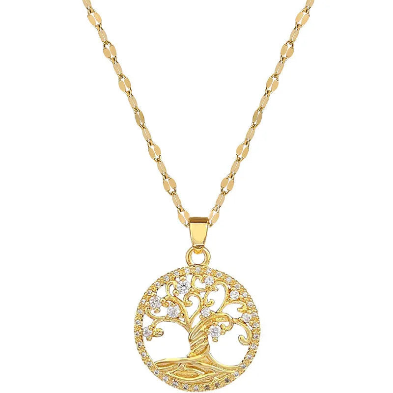 Gold plated necklace with tree and cross pendant featuring mother of pearl and rhinestones on adjustable chain