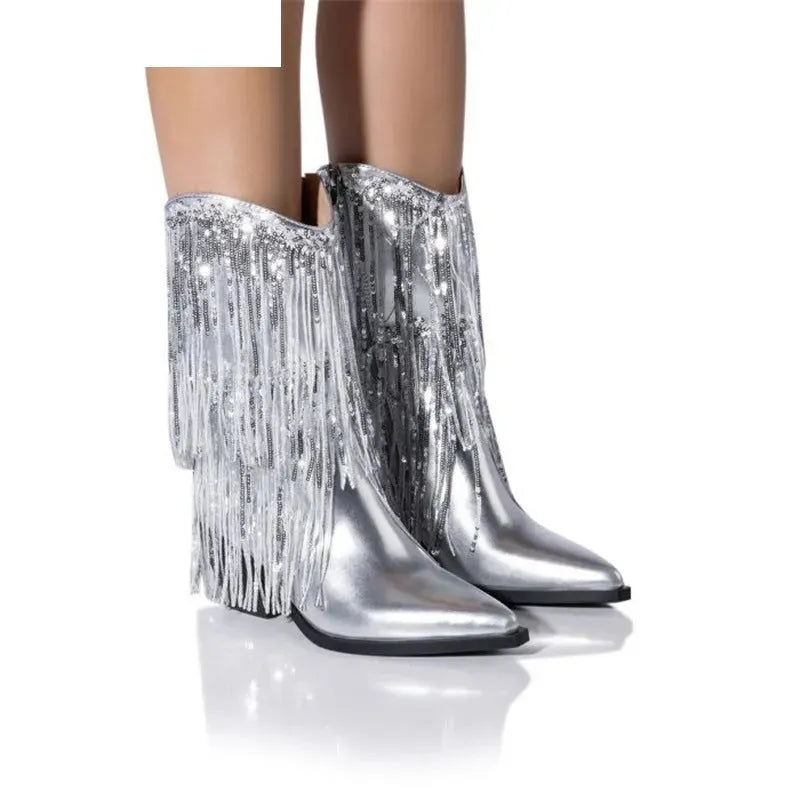 Women's black chunky heel tassel ankle boots with pointed toe on a plain background.