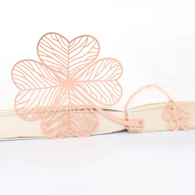 Brass metal hollow plated bookmark with leaf design and rose gold tassel
