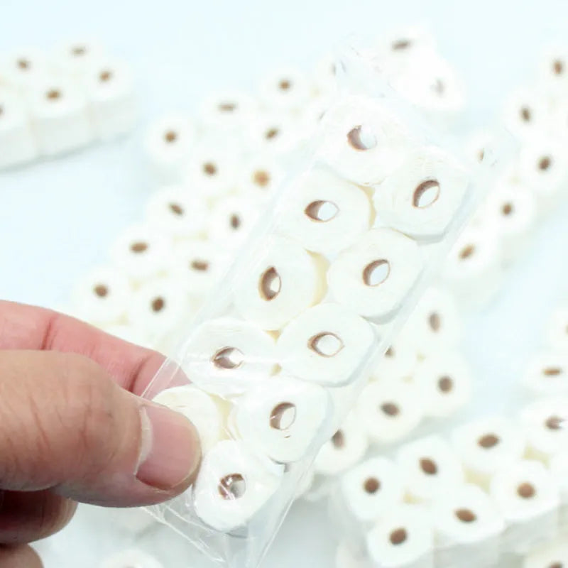 Miniature simulated toilet paper roll model made from paper, shown at 30mm by 15mm by 80mm scale.