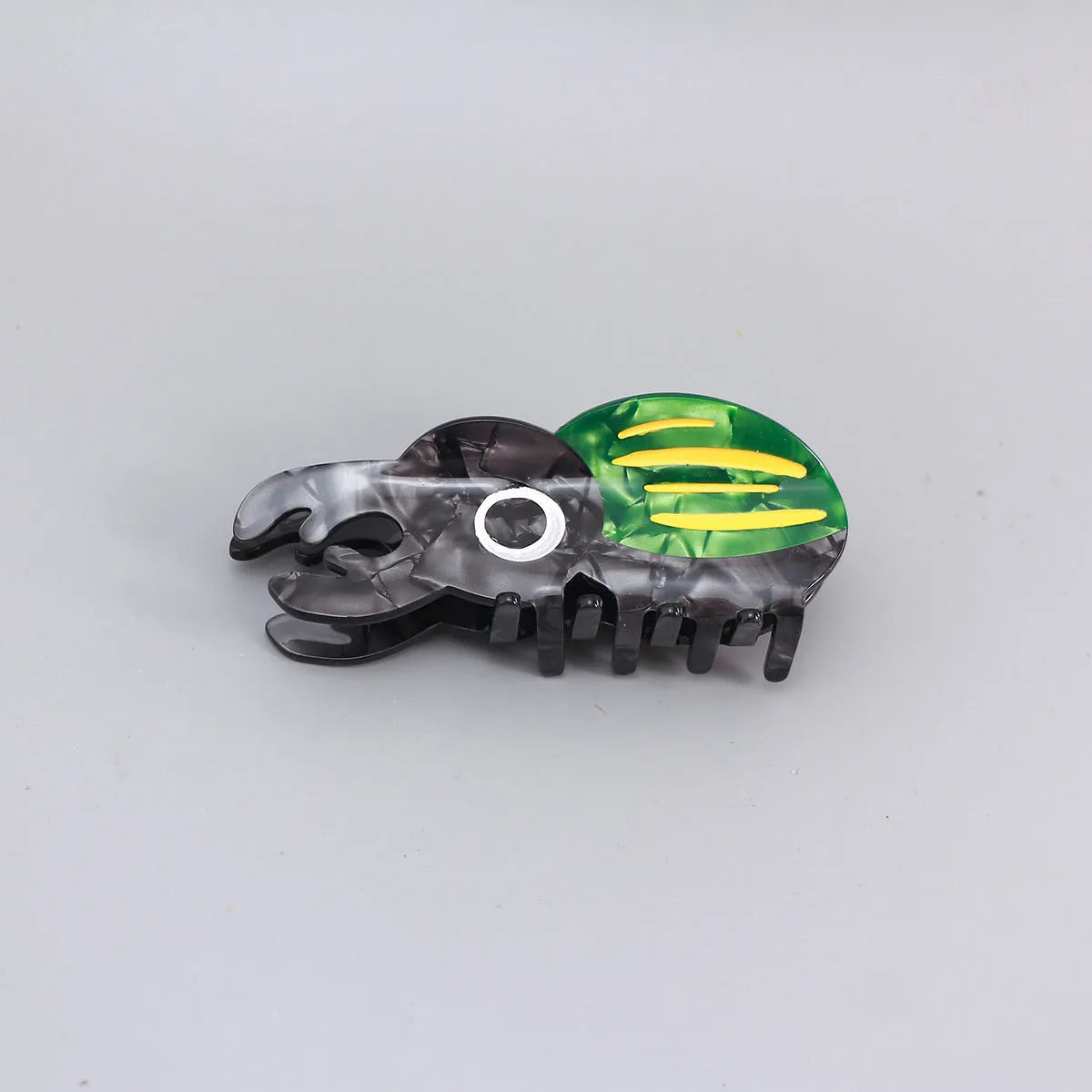 Handmade cellulose acetate beetle grip hair accessory with insect biology design