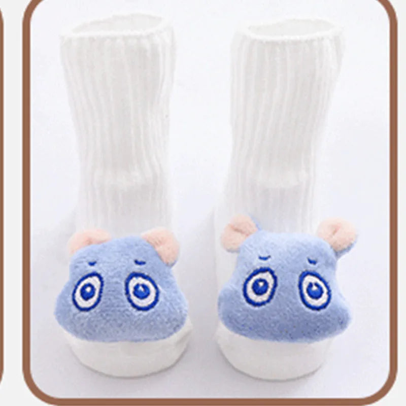 Cotton baby floor socks in a selection of colours and patterns like panda, lion, and bows, shown in sizes for infants.