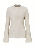 Long sleeve round neck polyester top in black with lantern sleeves, slim fit silhouette