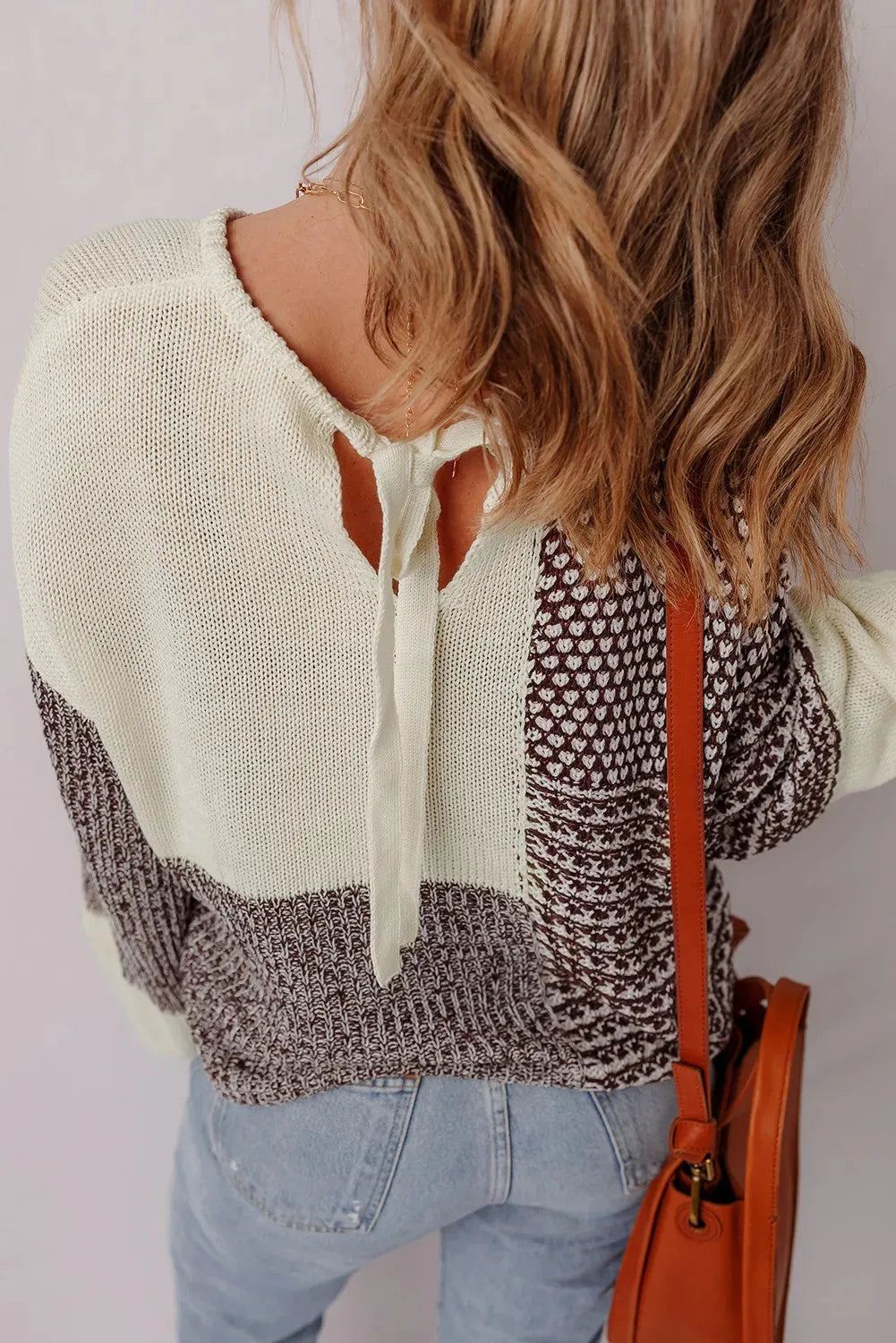 Dark khaki loose-fit sweater with colour block pattern and back tie detail