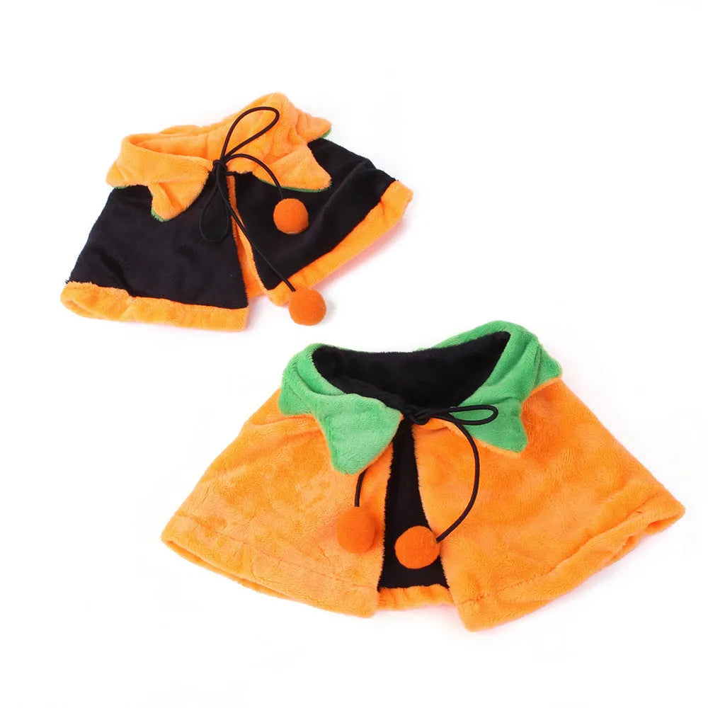 Orange pumpkin print double-sided plush cloak with matching hat on a dog for Halloween.