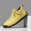 Men's mid-top Martin boot in khaki with sewn sole detail and elastic band.