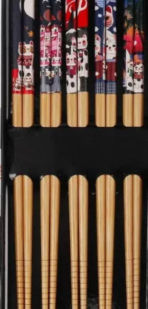 Set of five Japanese style patterned bamboo chopsticks showing lucky cat and pool elegant blue cartoon designs.