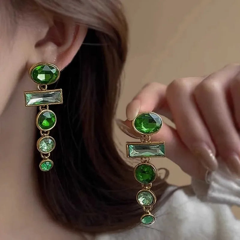 Green gradient geometric alloy earrings with dangling tassels and inlaid zircon stones.