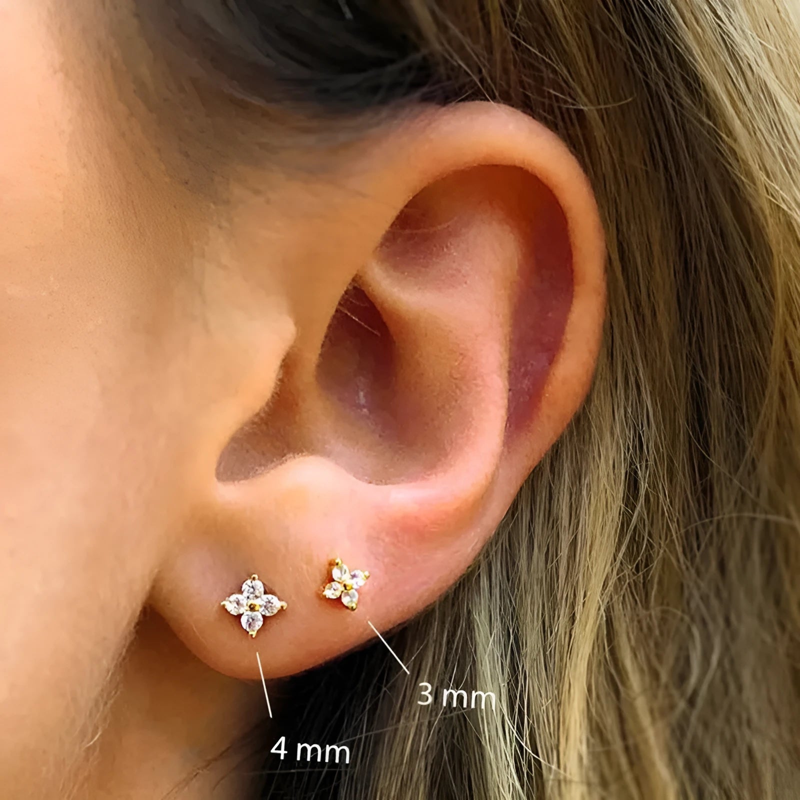 S925 sterling silver stud earrings with geometric petal crystal flower design in gold or platinum finish.