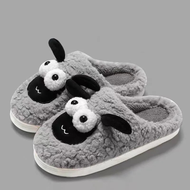 A pair of lamb thermal cotton slip-on slippers with a suede upper and sewn PVC sole.