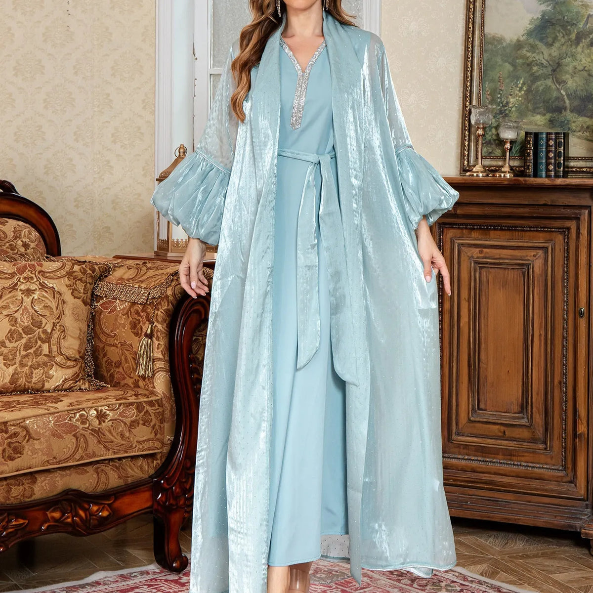 Arabic style two-piece dress set with long sleeves and rhinestone straps in blue.