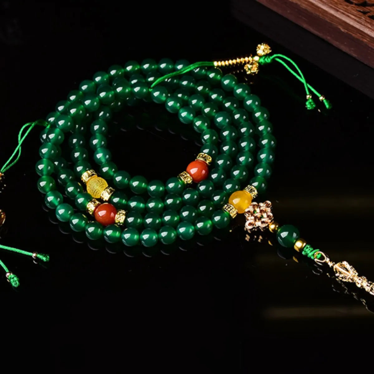 Handmade multi-circle bracelet with green agate beads from Brazil, shown in unisex styling.