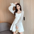 White waist-slimming chiffon patchwork dress with long sleeves on a woman
