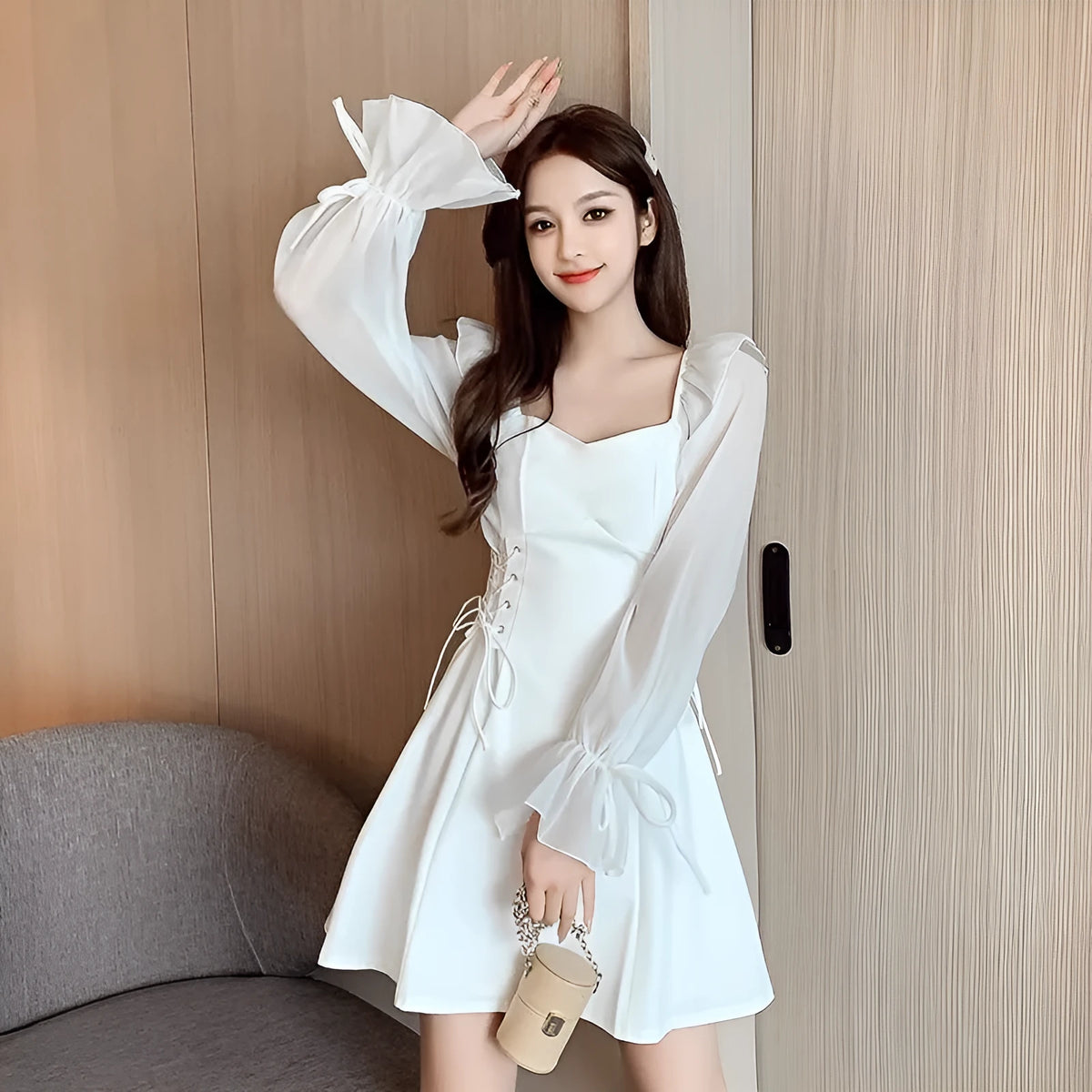 White waist-slimming chiffon patchwork dress with long sleeves on a woman