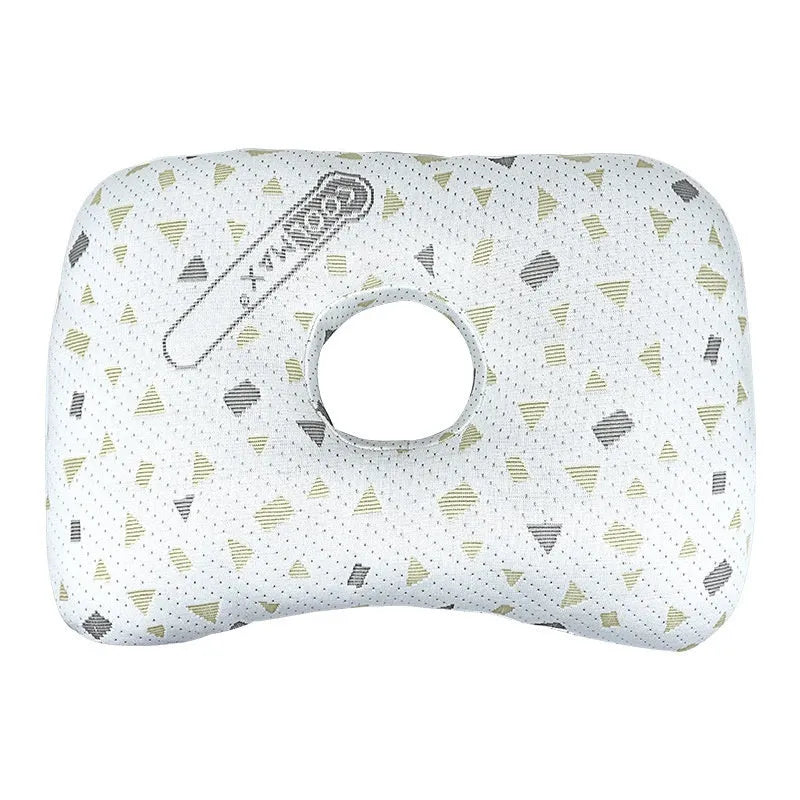 Beauty salon single hole ear pillow for adults in grey colour on a treatment bed.