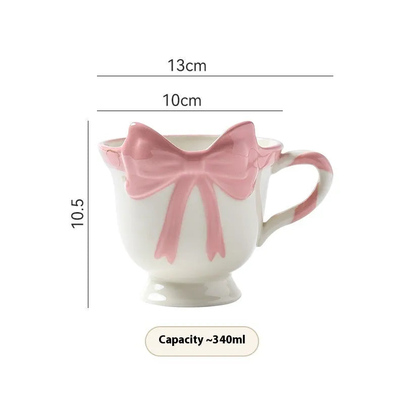 Ceramic heart bow design mug in white powder or black pink colour with 301-400ml capacity