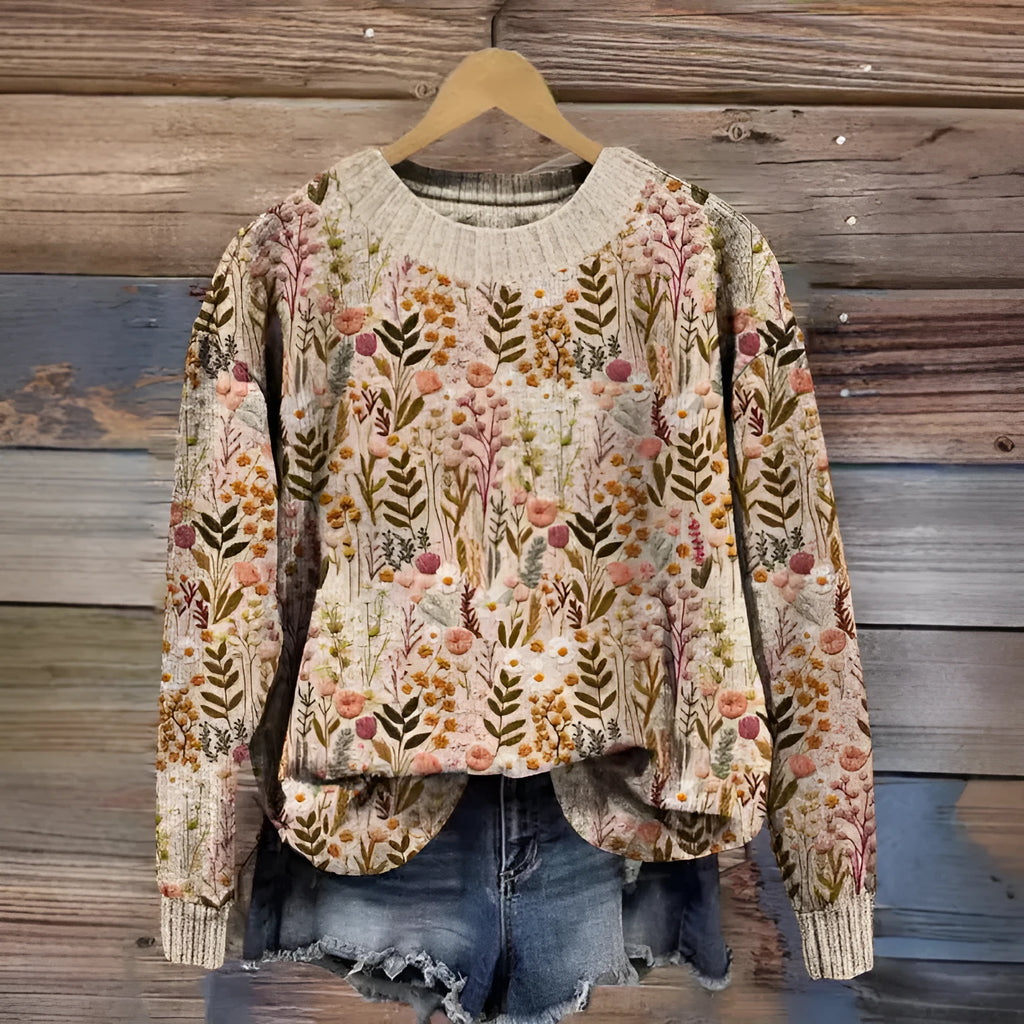 Round neck sweater with a small floral digital print pattern on the front.