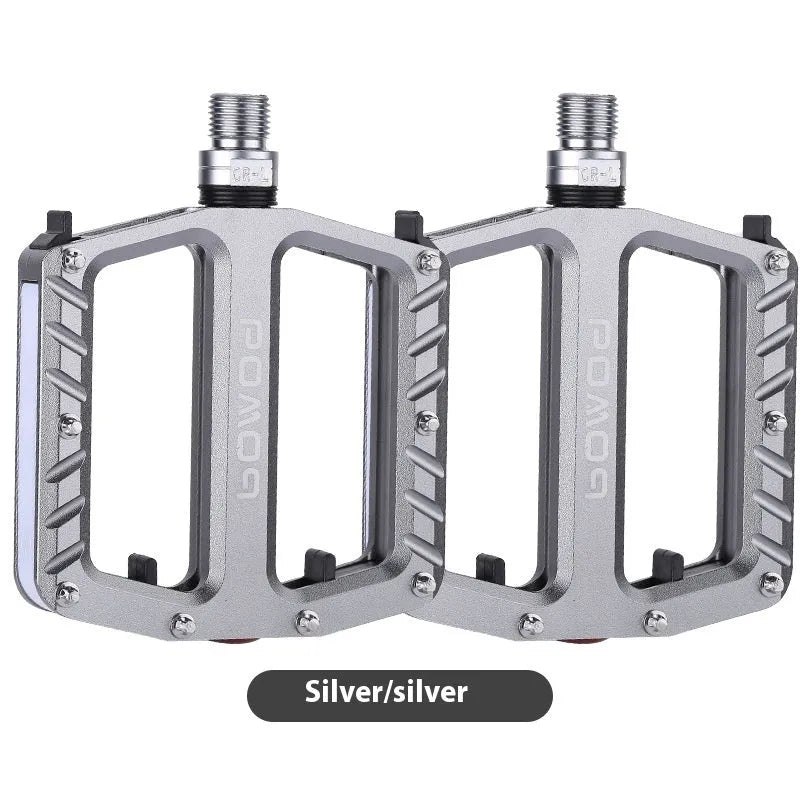 Bicycle pedal with integrated LED lights in aluminium alloy construction showing colour options