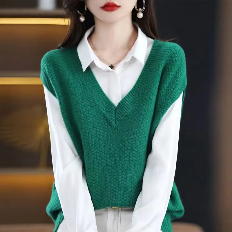 Women's cream V-neck sleeveless knit vest with a raised 3D pattern, laid flat.