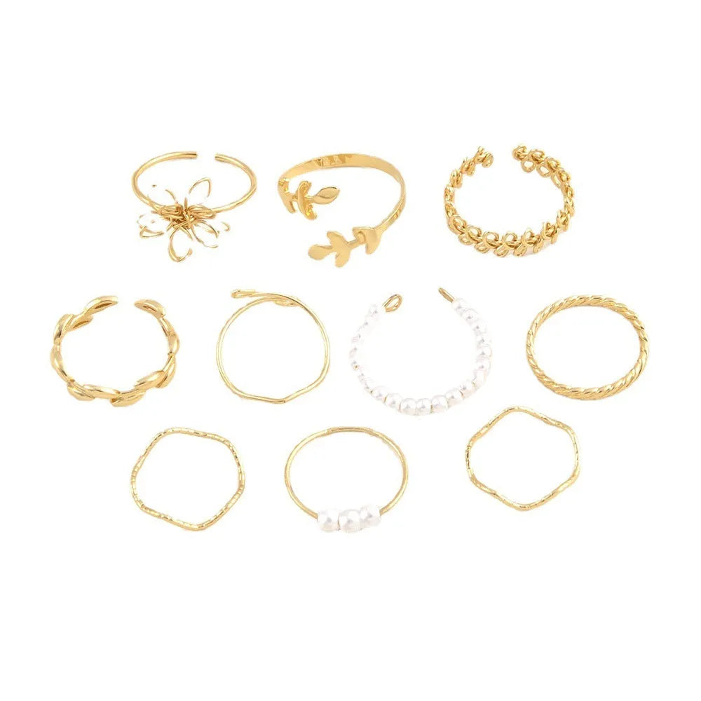 Gold coloured openwork flower shape alloy ring with a glossy electroplated finish.