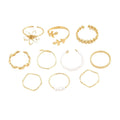 Gold coloured openwork flower shape alloy ring with a glossy electroplated finish.