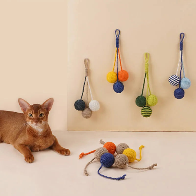 Bite-resistant cat teaser stick with wire core and three attached colourful catnip balls.