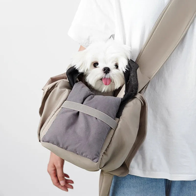 Apricot coloured cloth pet carrier handbag for small dogs and cats, shown with dimensions 41cm by 16cm by 28cm.