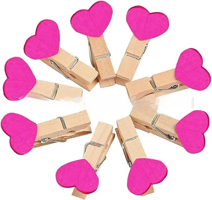 Five small handmade solid wood heart-shaped clips in red, rose red, and white colours.
