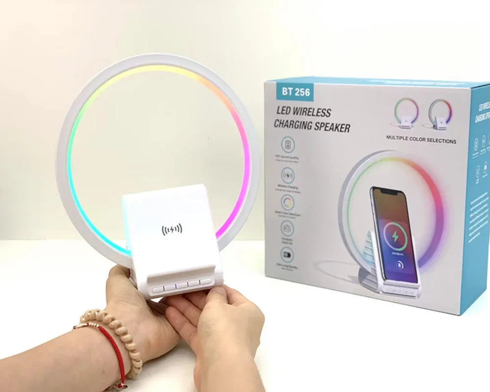 White rectangular smart Bluetooth speaker with integrated wireless charging pad and ambient lighting