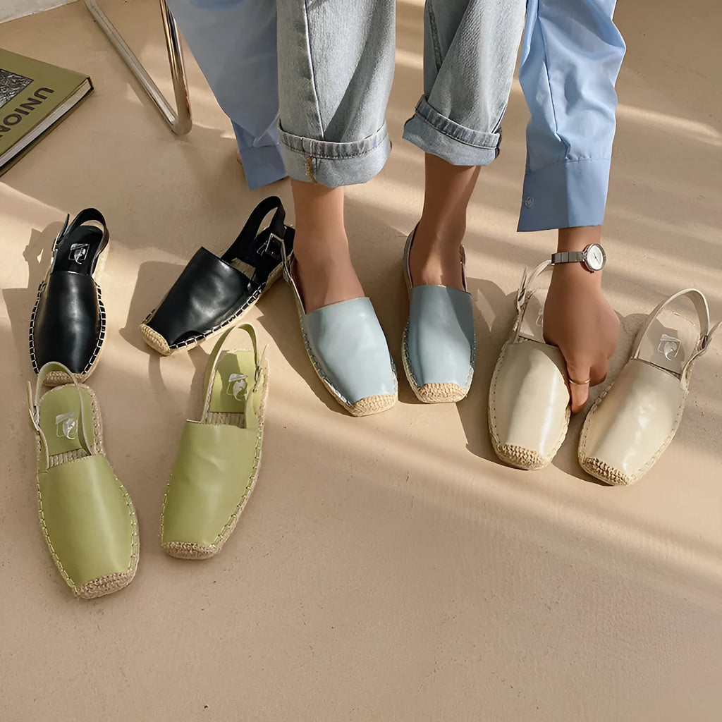 Women's beige retro fisherman flat sandals with canvas upper and flat sole.