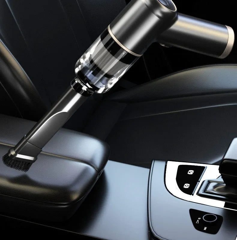 Black wireless handheld car vacuum cleaner with multiple nozzles on a black background