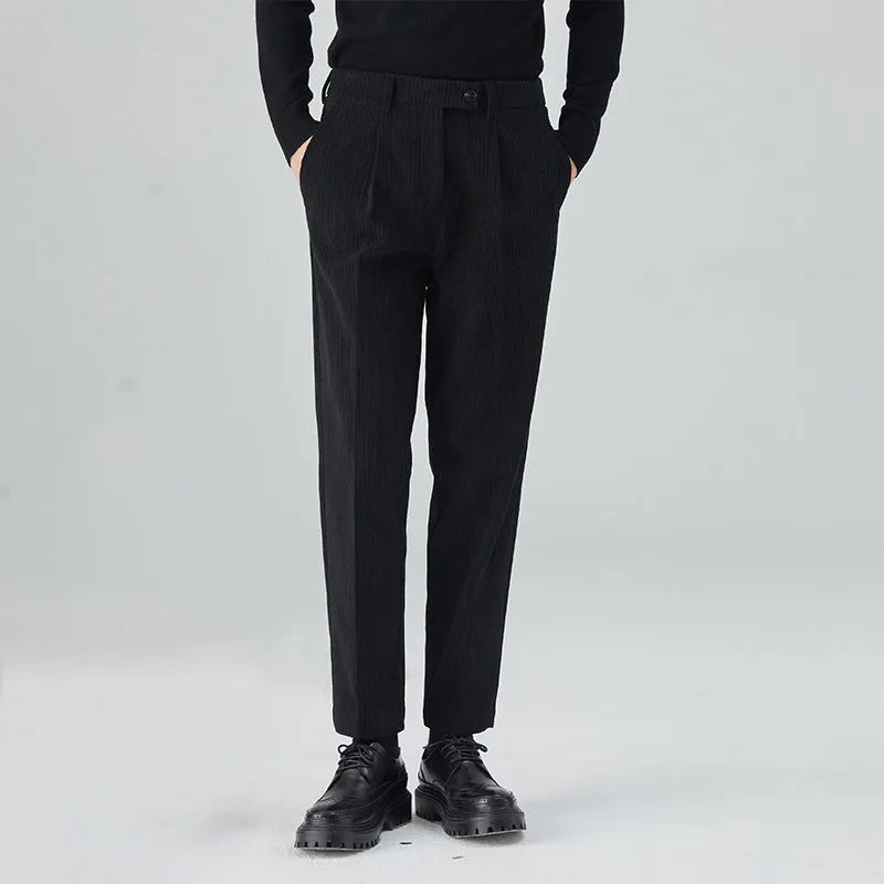 Men's straight-leg loose fit corduroy trousers in beige shown on a model.
