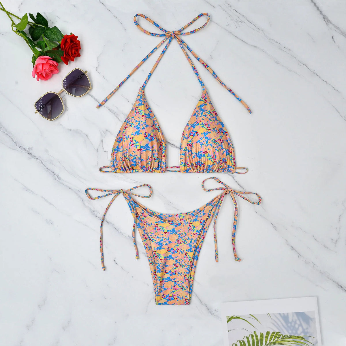 Lace-up bikini swimsuit in picture colour with backless briefs design for swimming.