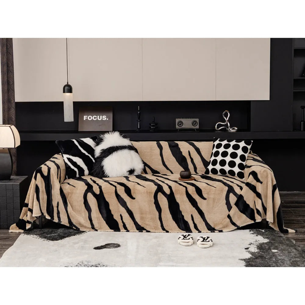 Zebra pattern flannel sofa cover and pillowcase set on a sofa, shown in caramel colour.