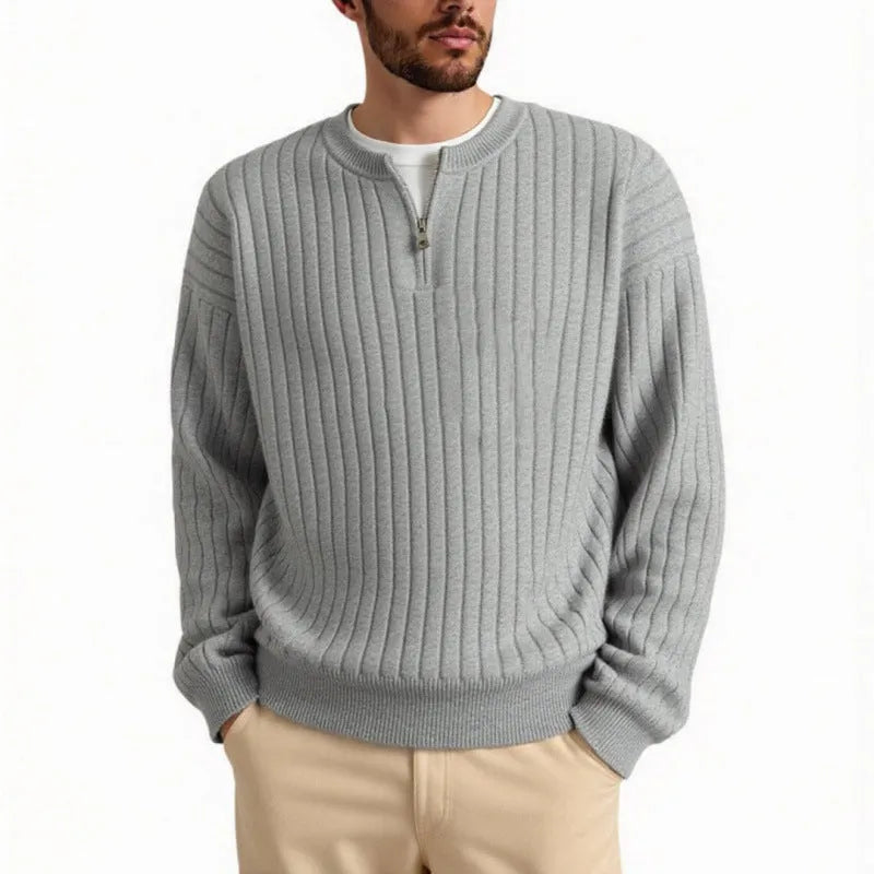 Men's grey half zip textured knit sweater with a loose fit and long sleeves.