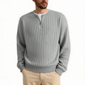 Men's grey half zip textured knit sweater with a loose fit and long sleeves.