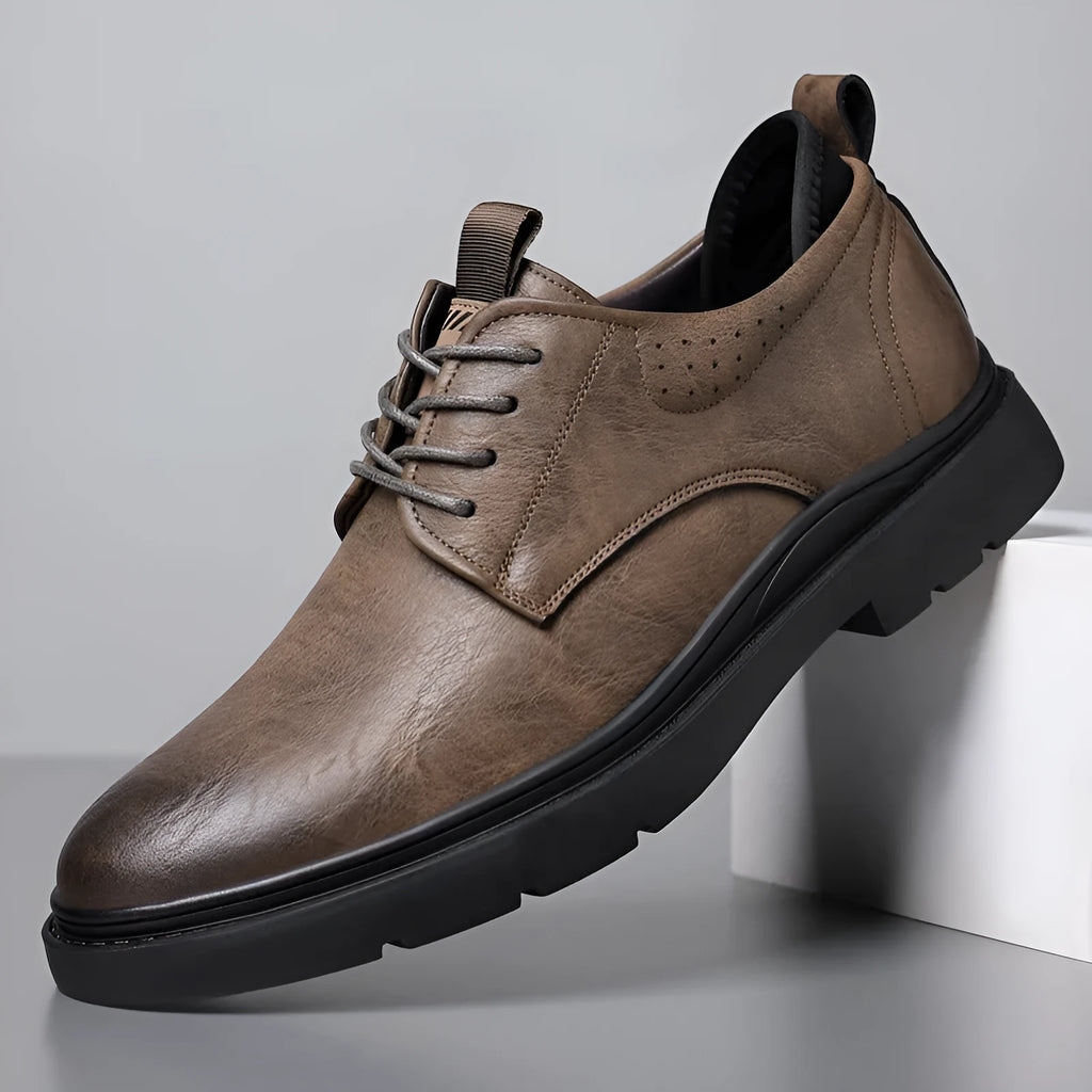 Men's black leather casual sneakers with sewing line detailing and rubber soles