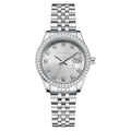 Women's silver alloy quartz watch with calendar display on a wrist