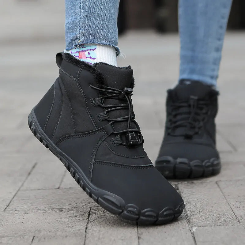 Unisex black waterproof snow boots with fleece lining and rubber soles on a white background