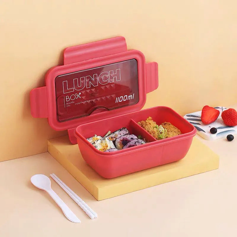 Green partitioned bento box with four compartments showing 20.5 cm plastic lunch container