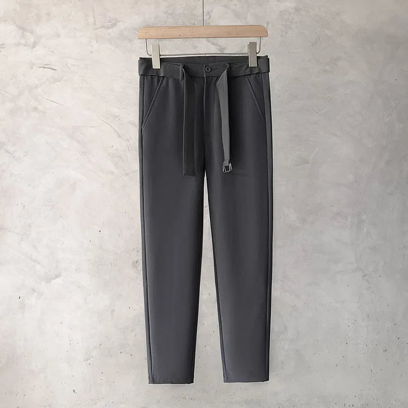 Boys slim straight trousers in wool blend fabric on a hanger, showing tapered leg