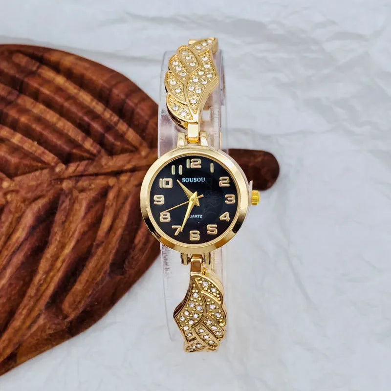 Women's stainless steel watch with round dial showing gold surface, 9mm thickness, and vachette clasp buckle