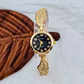Women's stainless steel watch with round dial showing gold surface, 9mm thickness, and vachette clasp buckle
