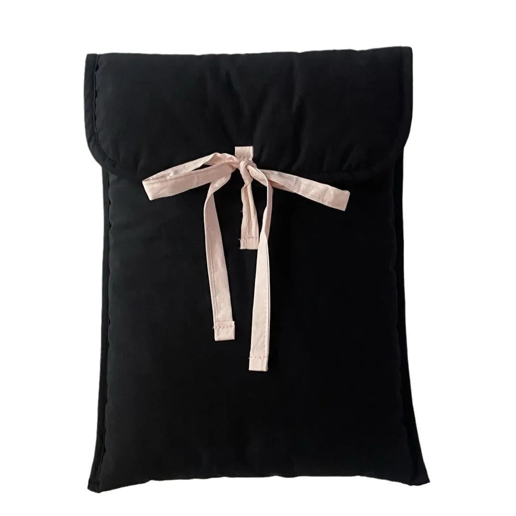 Women's black quilted computer bag with ballet bow and striped lining